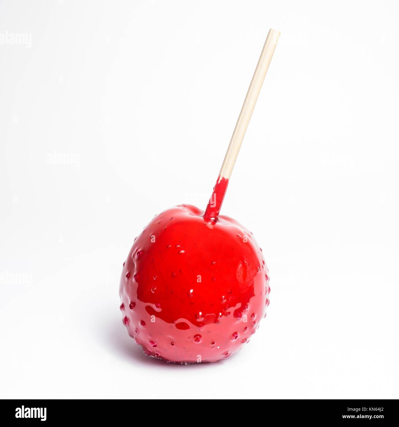 toffee apple red on white background (isolated). Stock Photo