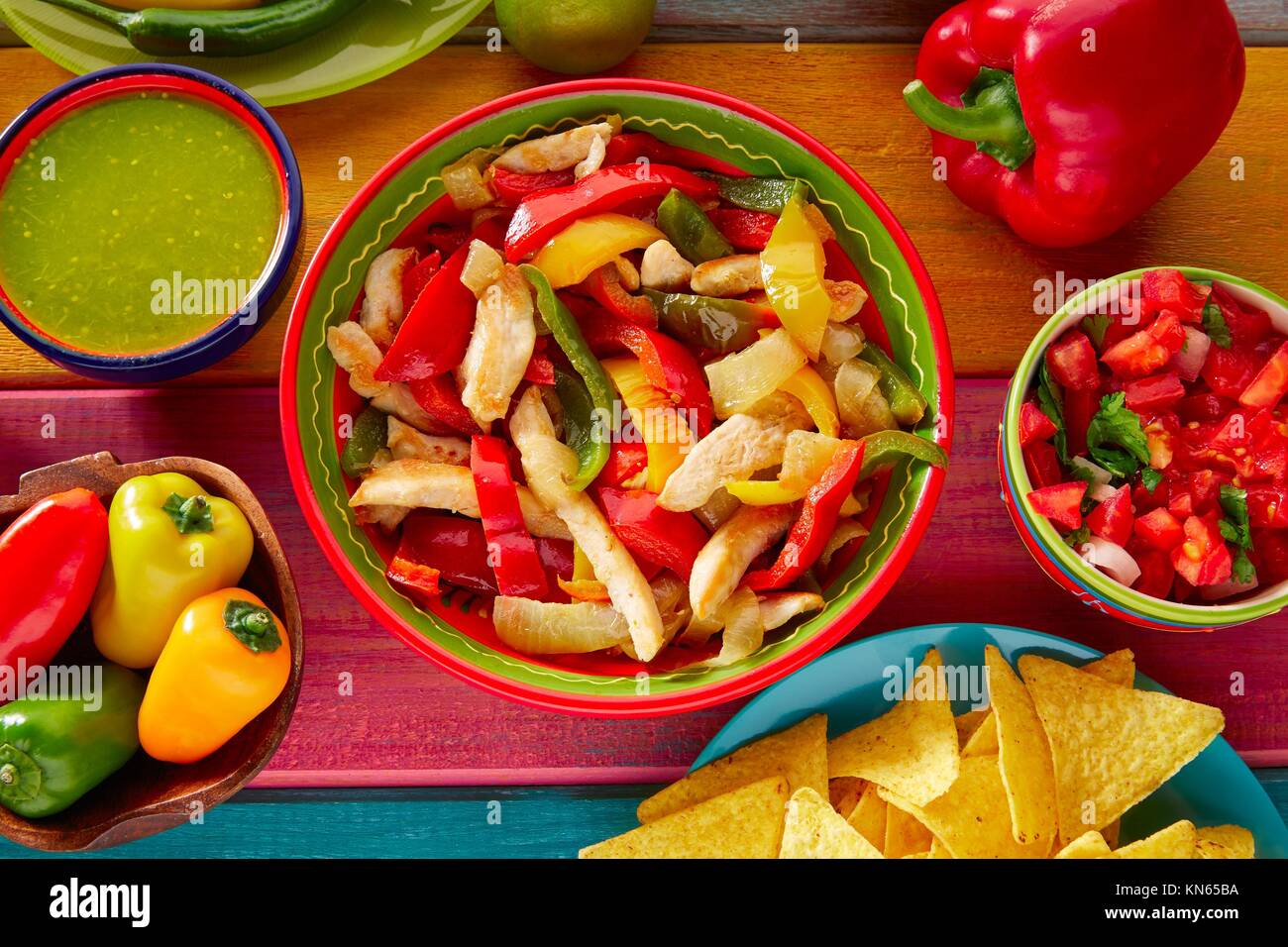 Chicken fajitas with mexican food guacamole pico de gallo chili peppers
