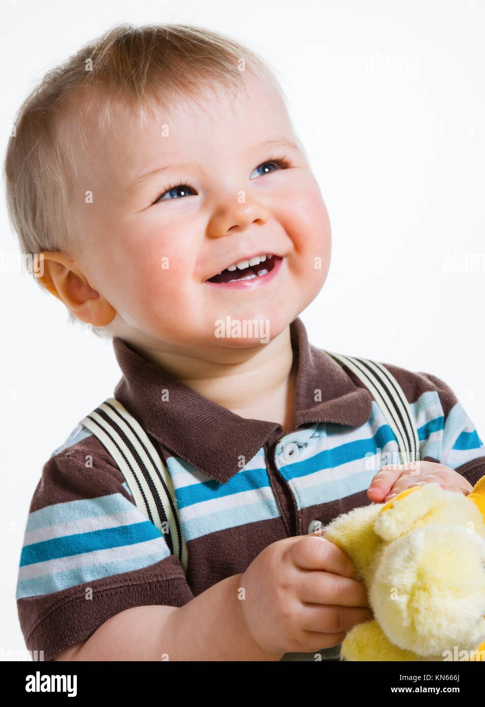 Baby boy, 16 Months old wearing striped shirt and suspenders, white background Stock Photo Alamy