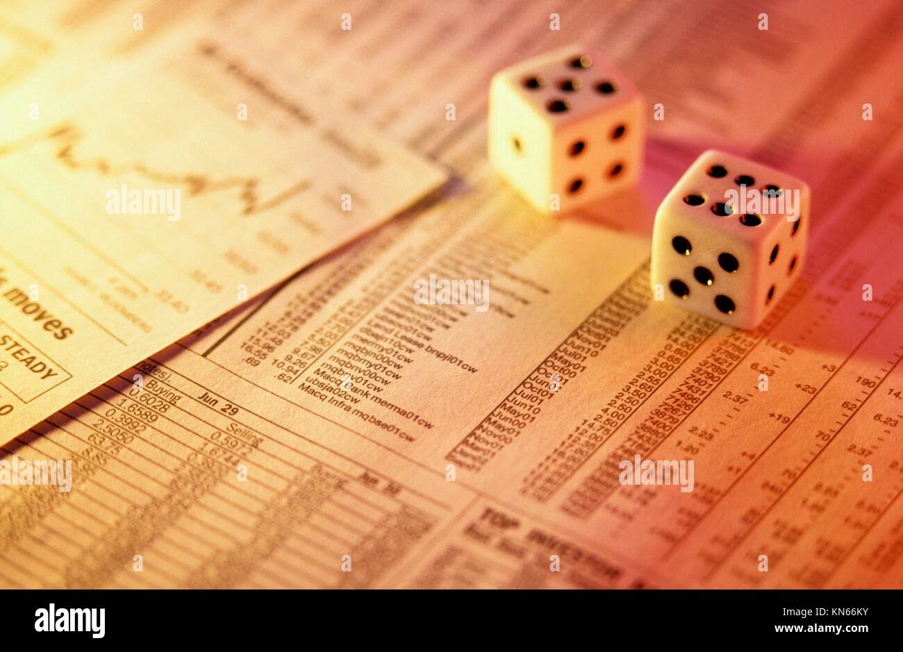 Dice on financial page Stock Photo Alamy
