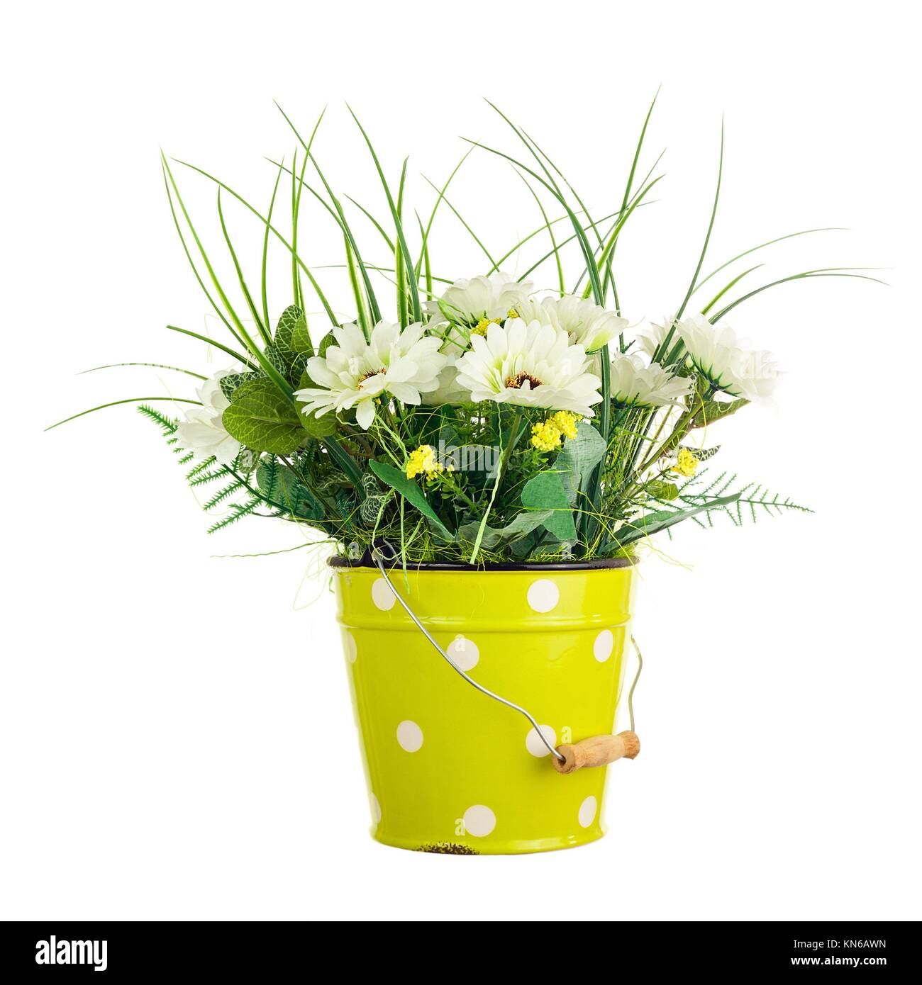 Bouquet from artificial flowers arrangement centerpiece in yellow metal