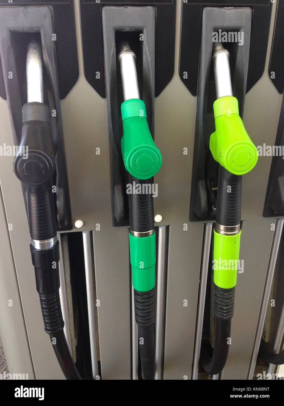 Detail of hoses of petrol pump at a gas station, Spain. Stock Photo