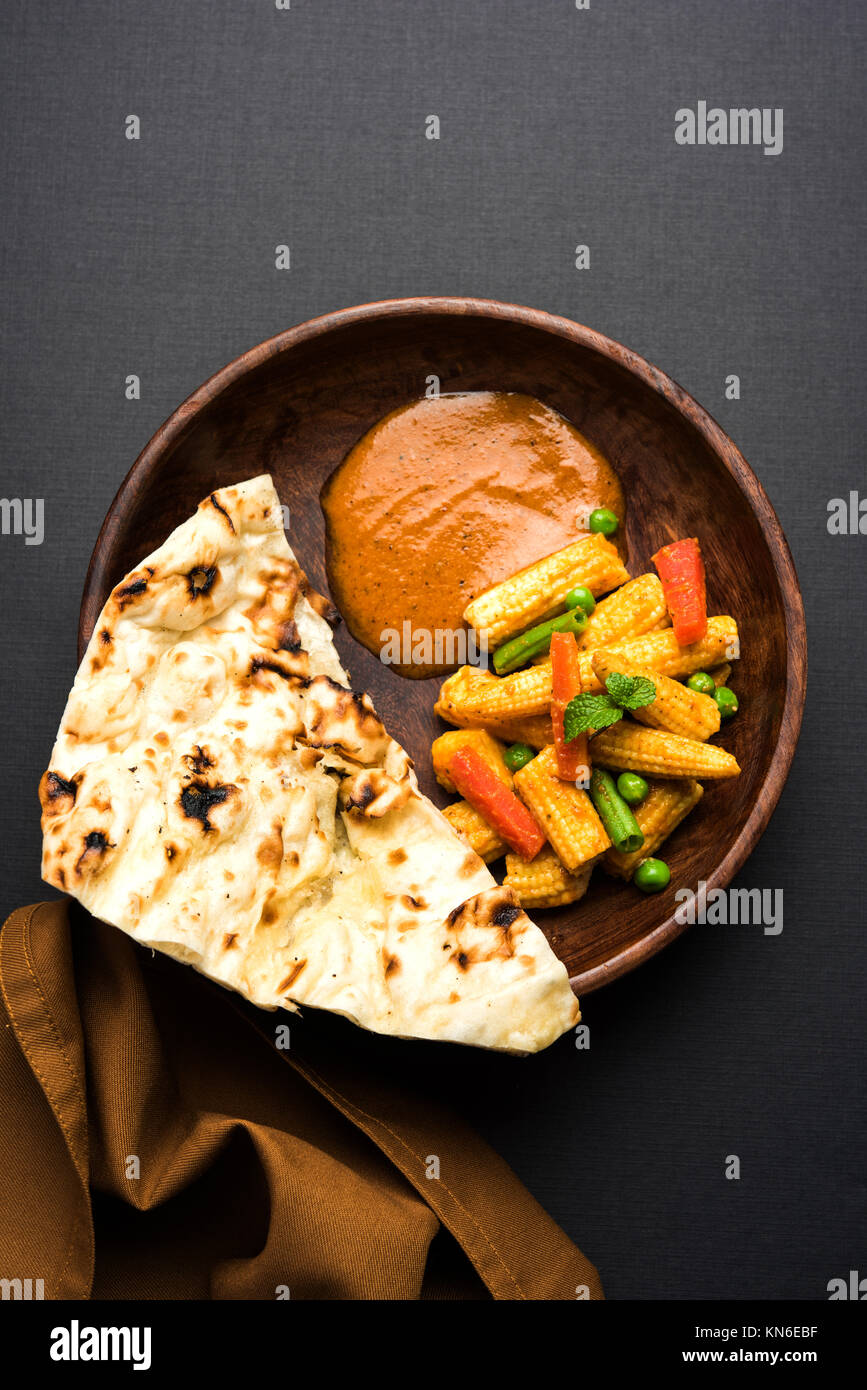 Indian Baby Corn Masala or spicy Baby corn curry served with roti or