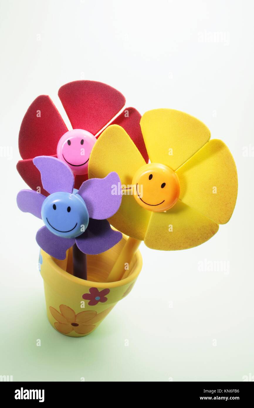 Plastic flowers in pot. Stock Photo