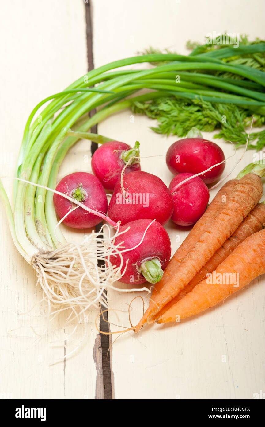 raw root vegetable on a rustic white wood table. Stock Photo