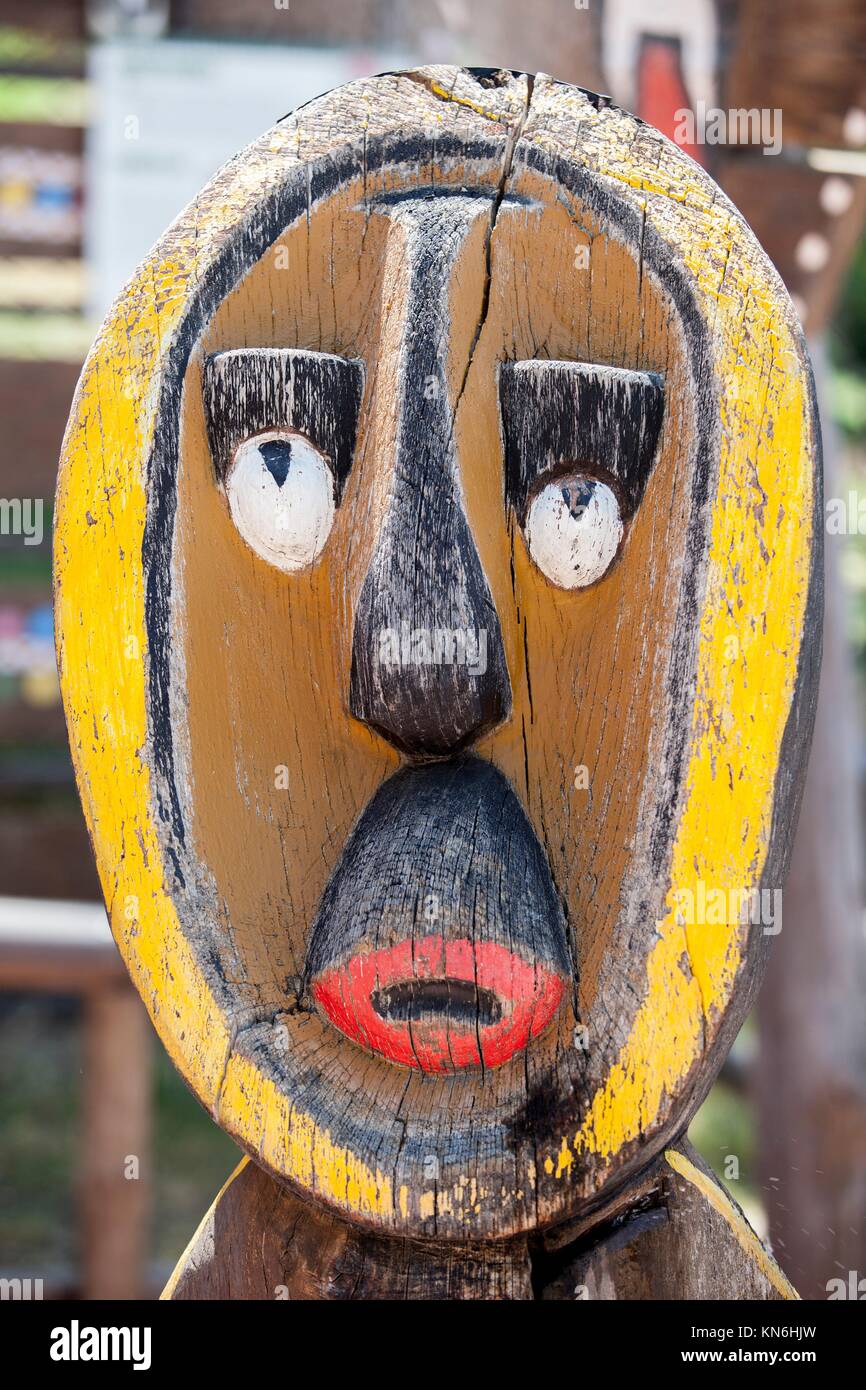 Wooden painted african mask. Outdoors shot. Stock Photo