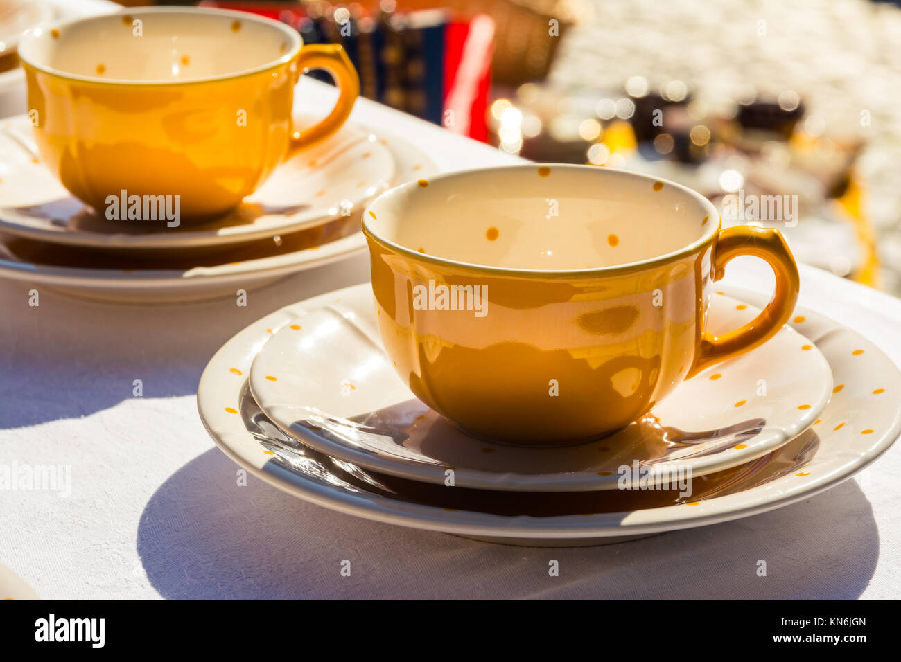 Yellow Polka Dot Teacup on White Tablecloth Tablewear Cafe Drinking Stock Photo