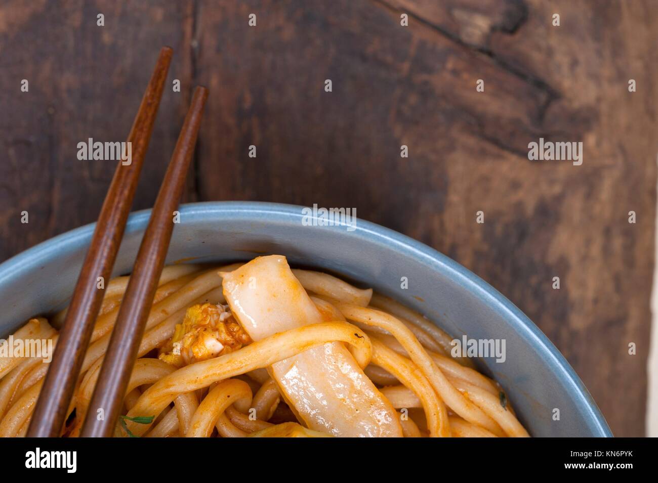 hand pulled stretched Chinese ramen noodles on a bowl with chopstick