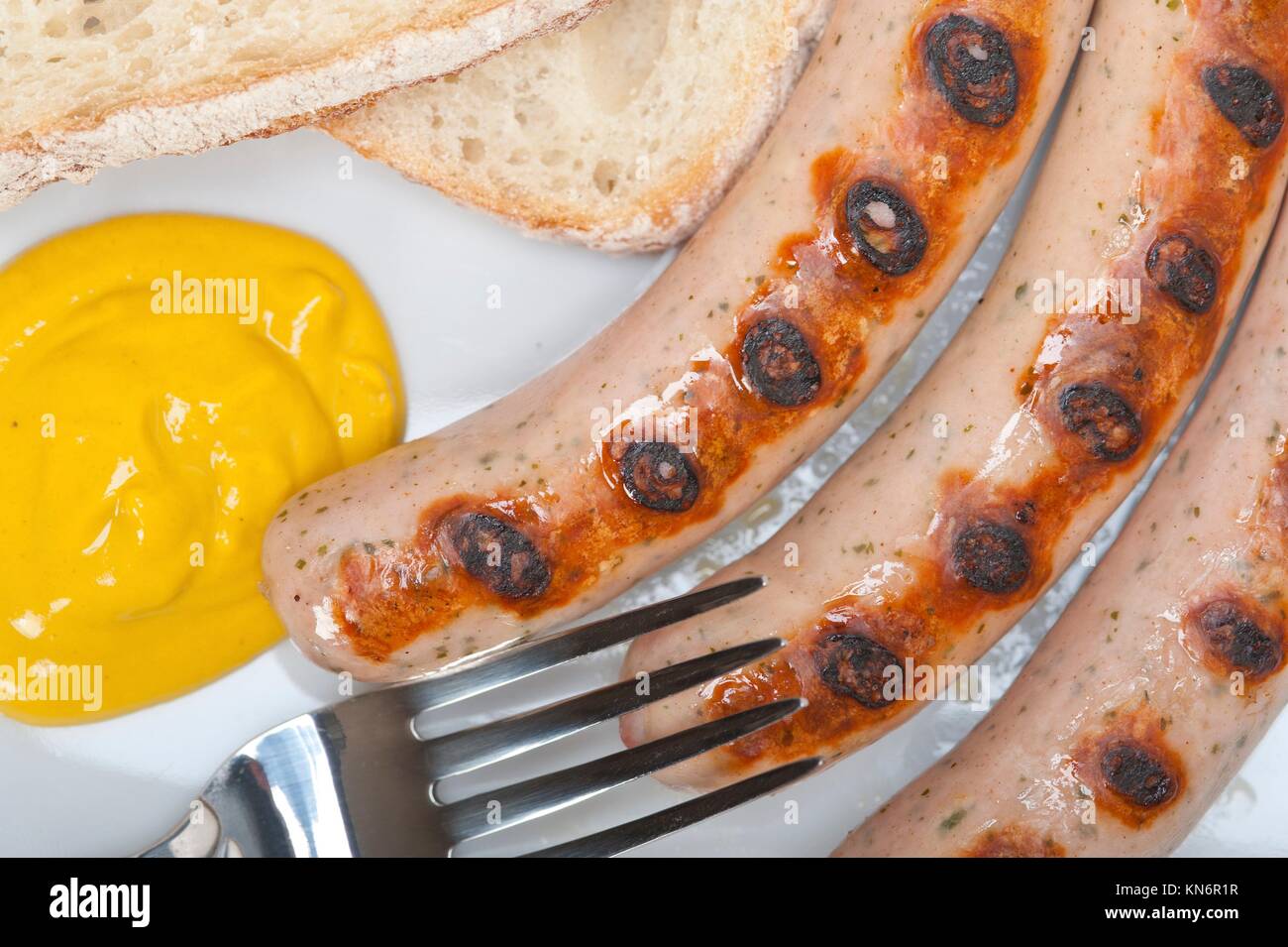 traditional fresh German wurstel sausages grilled with yellow mustard Stock Photo Alamy