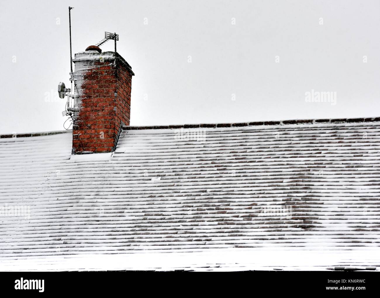 A light dusting of snow on a rooftop Stock Photo Alamy