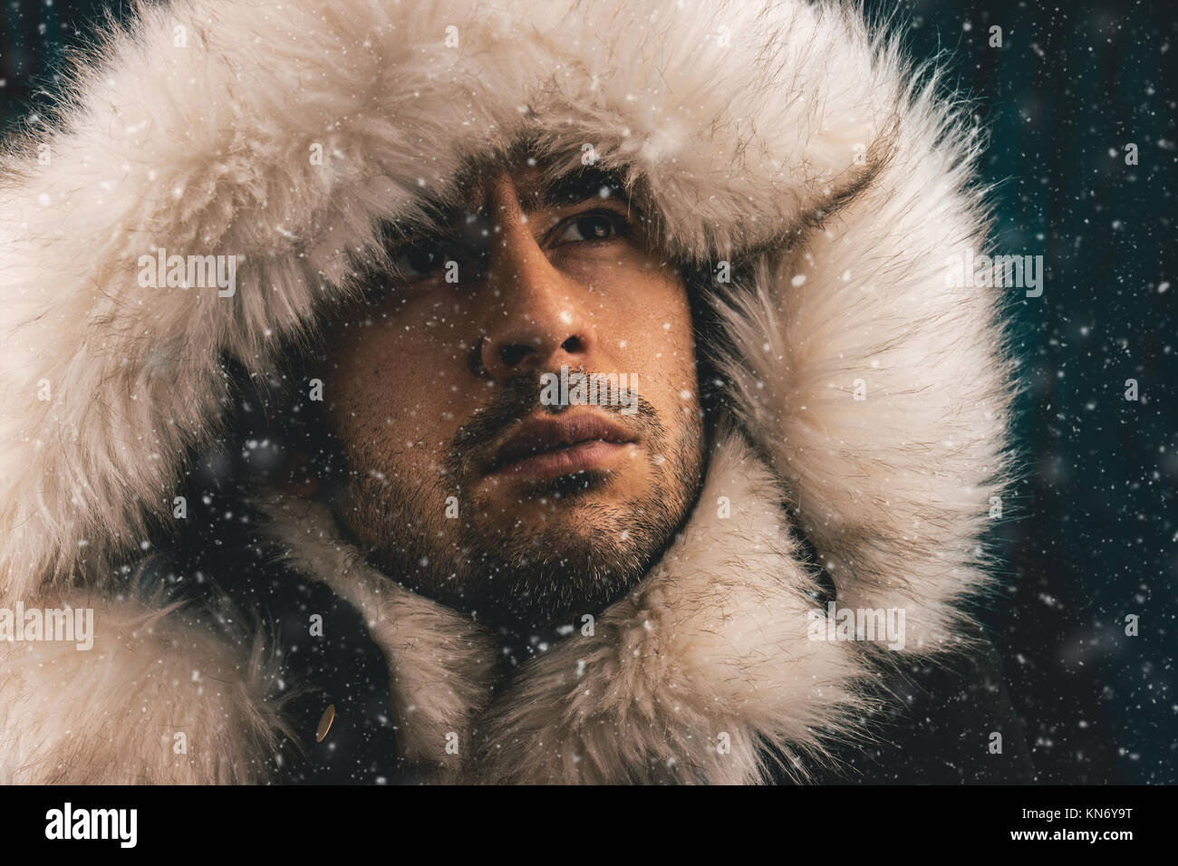 Close up portrait of a white man dressed with an eskimo jacket in the snow  Stock Photo - Alamy