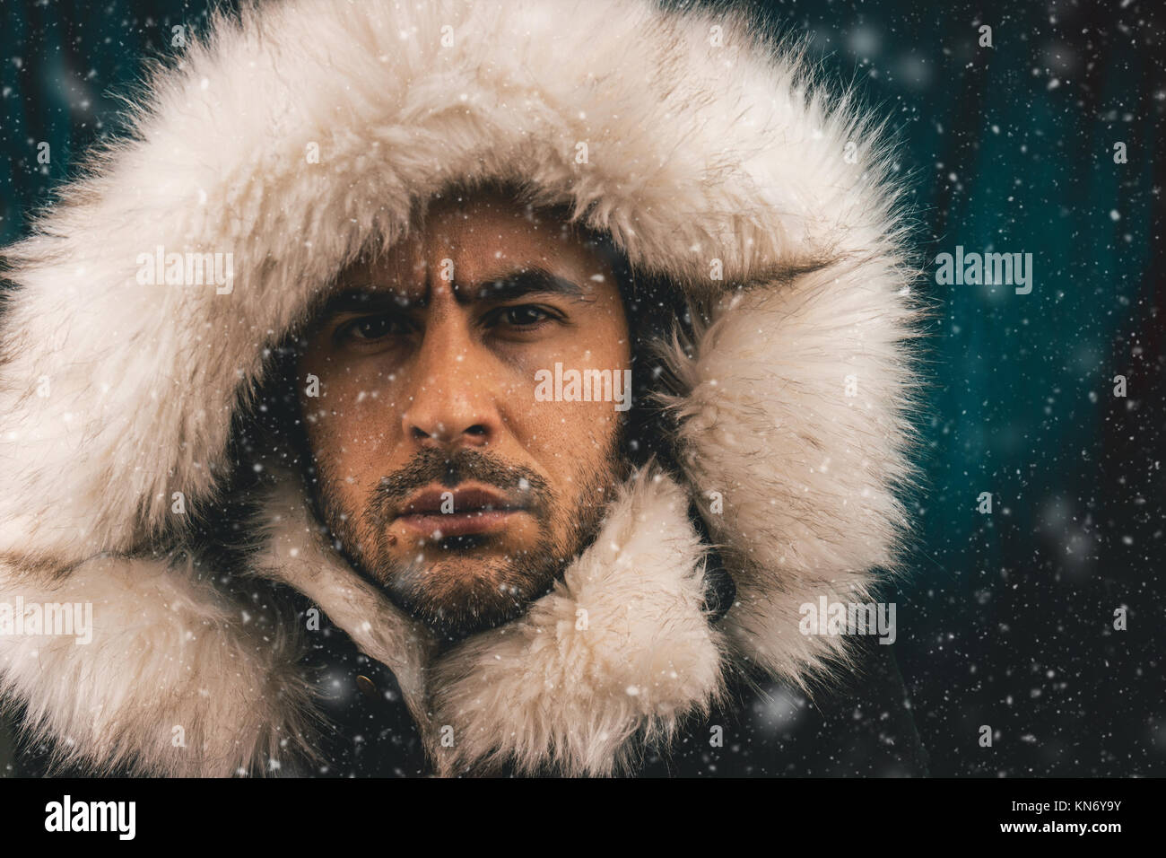 Close up portrait of a white man dressed with an eskimo jacket in the snow  Stock Photo - Alamy