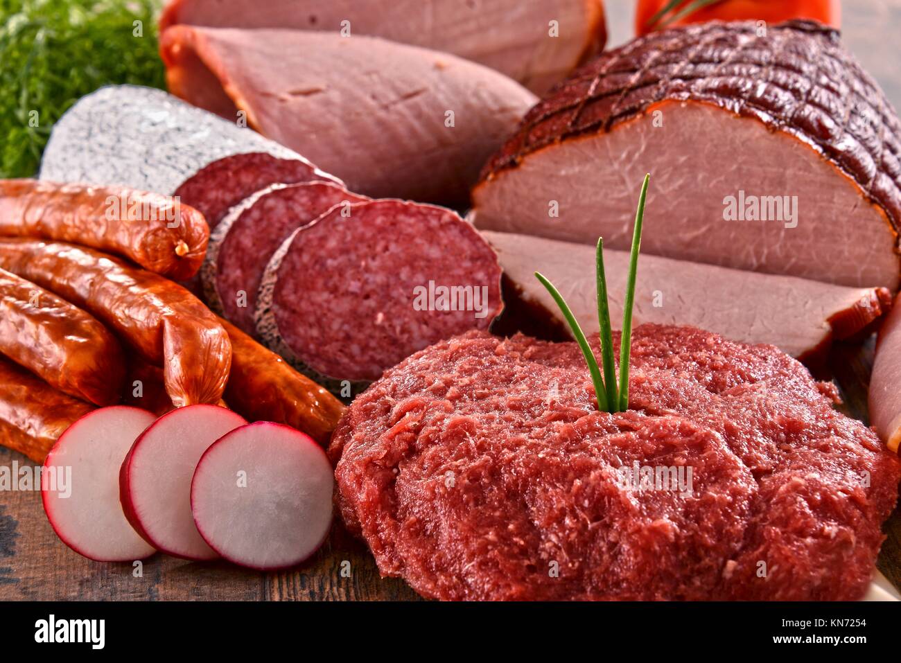 Assorted meat products including ham and sausages Stock Photo Alamy