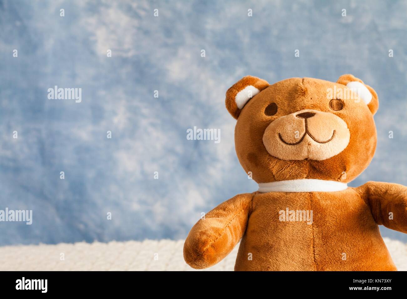 Teddy Bear toy on blue sky background with copyspace Stock Photo Alamy