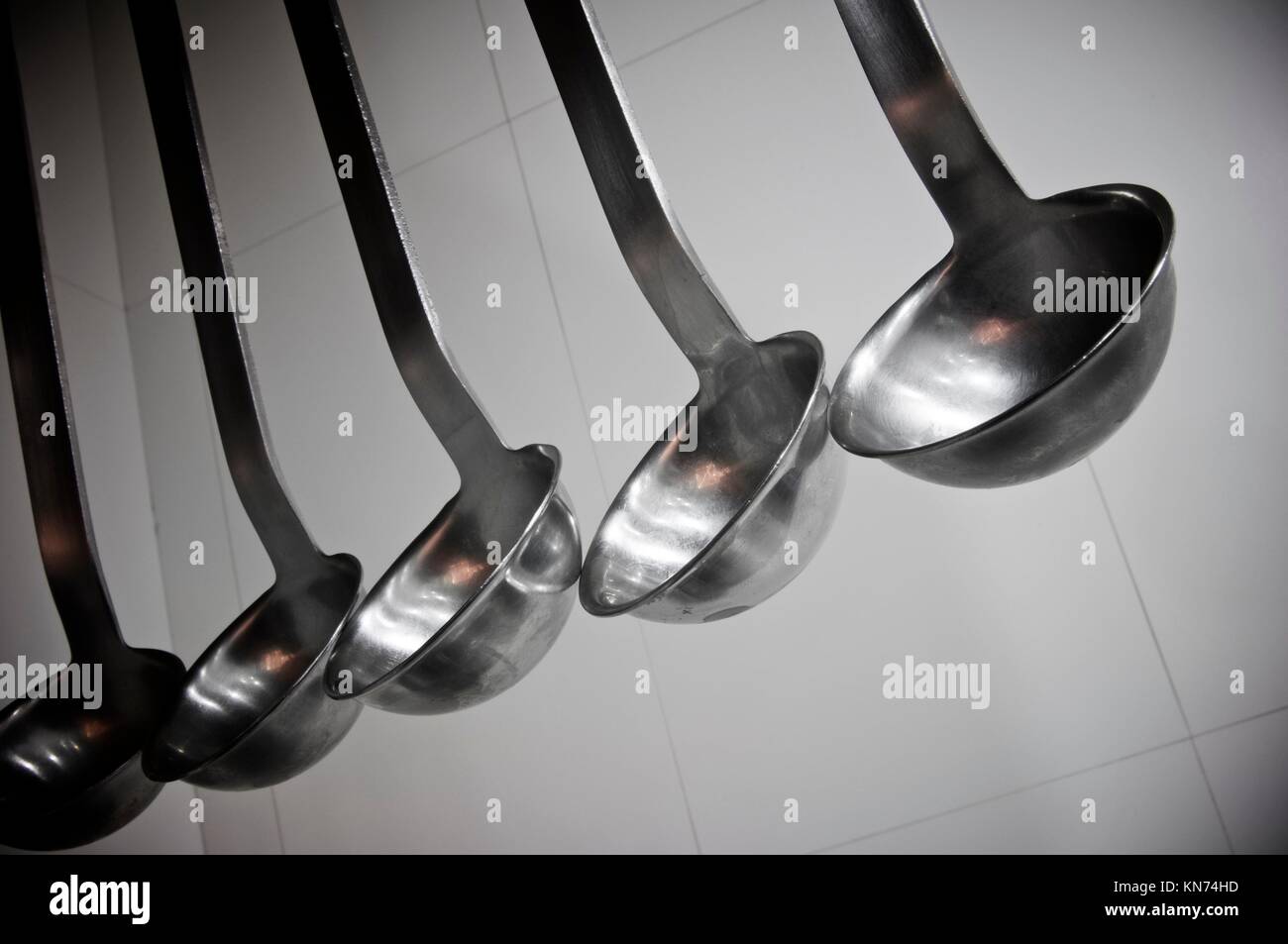 view of five spoons to serve soup Stock Photo Alamy