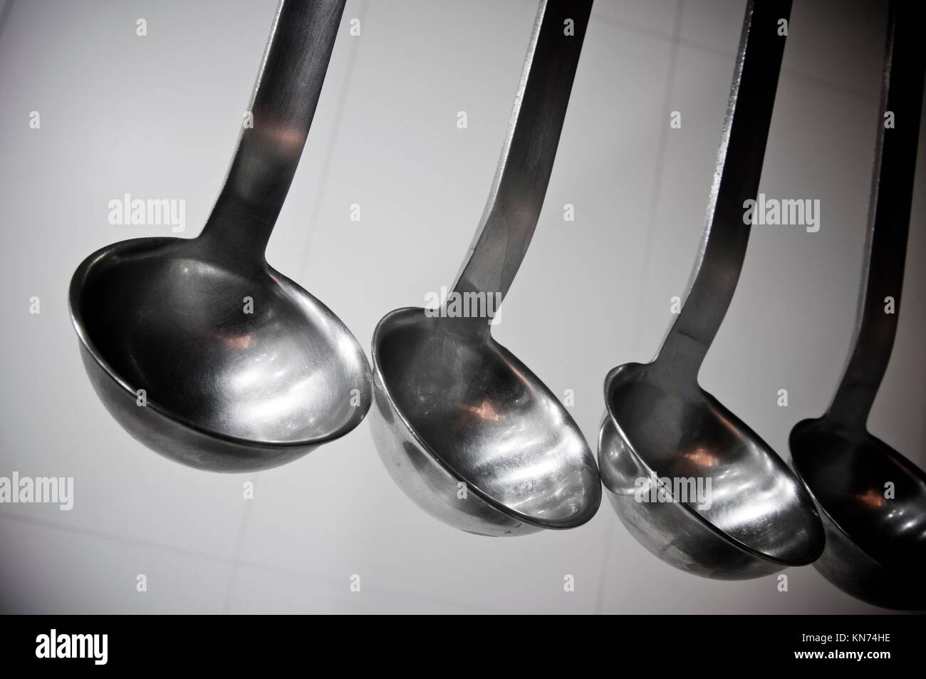 view of five spoons to serve soup Stock Photo Alamy