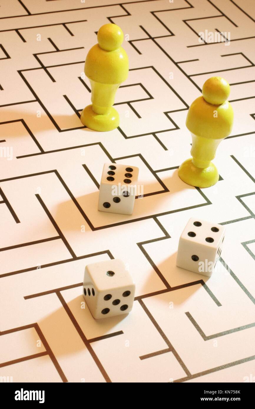 Dice and chess pieces on labyrinth Stock Photo Alamy