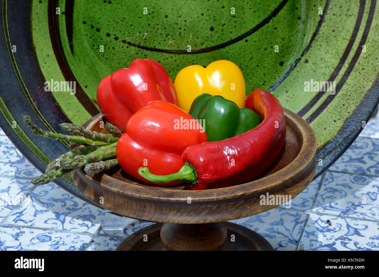 Close up of colourful Asparagus, Bell and Cayenne peppers Stock Photo