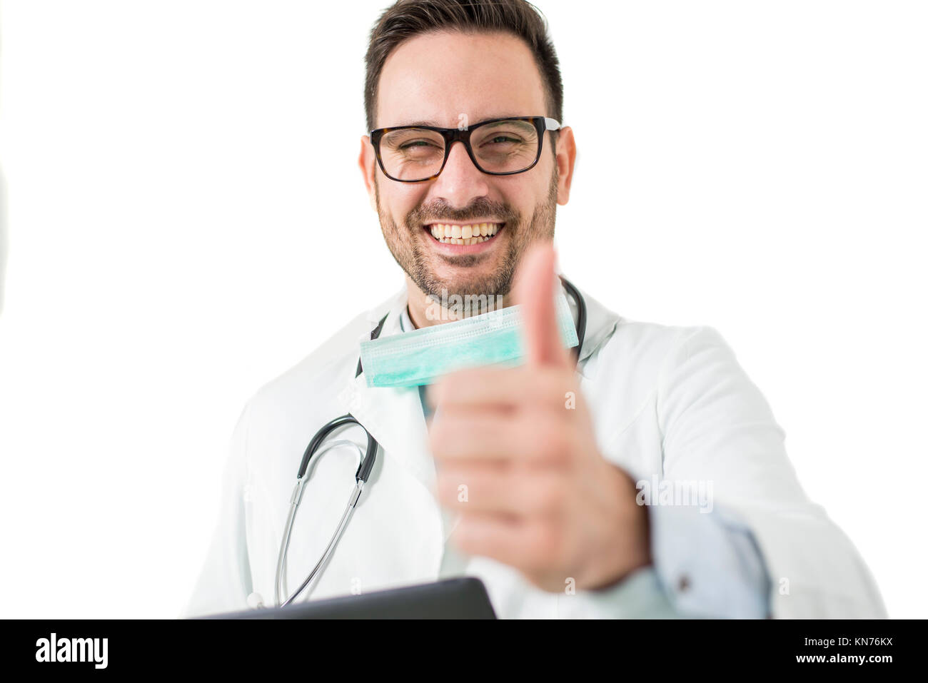 Handsome young doctor with glasses gesture with thumb up Stock Photo
