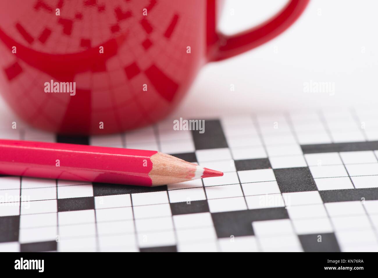 Closeup of crossword puzzle, coffee cup and red pencil. Conceptual image of  problem solving, finding solutions and intelligence Stock Photo - Alamy