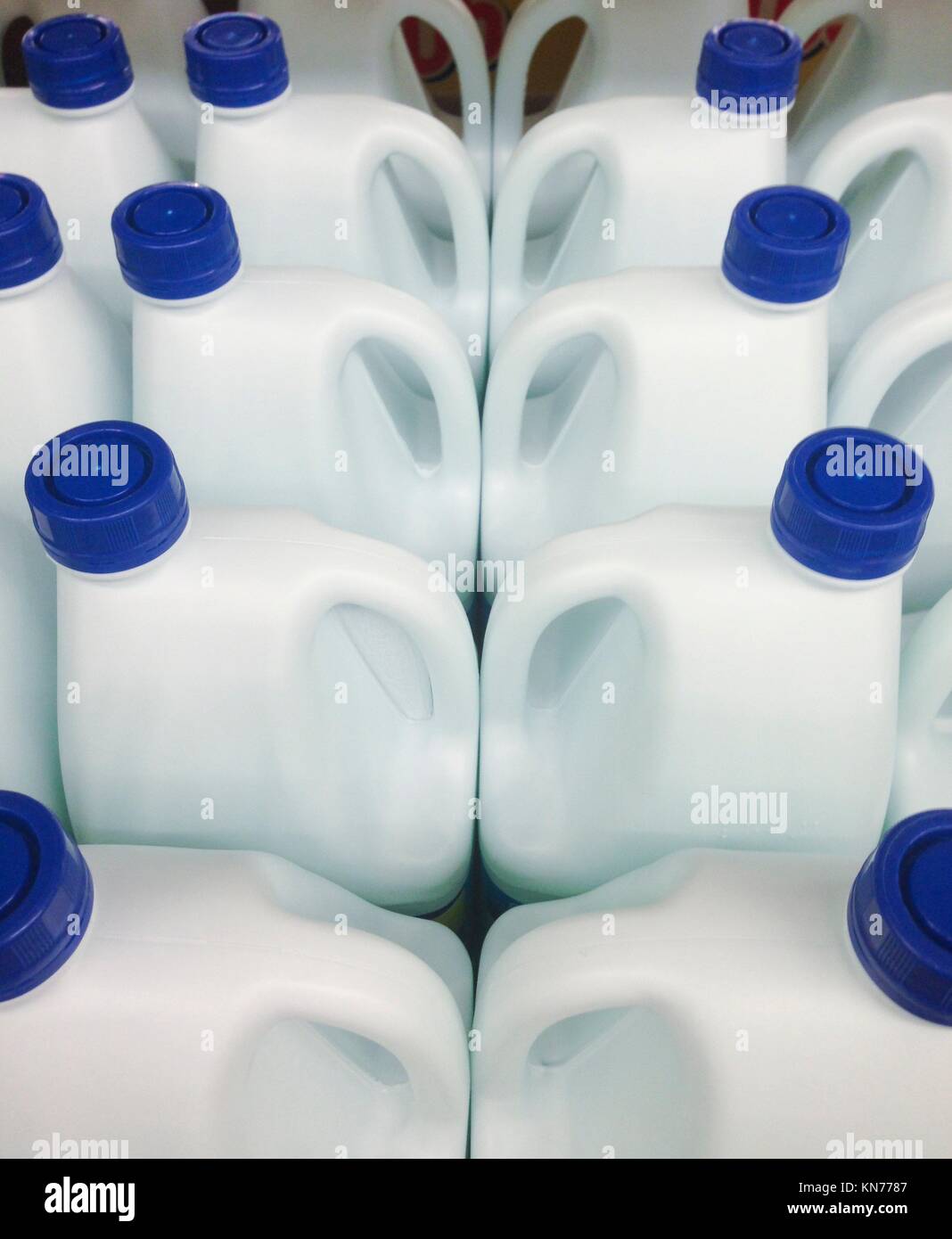 Photo of several bleach white bottles on sale in a supermarket. Stock Photo
