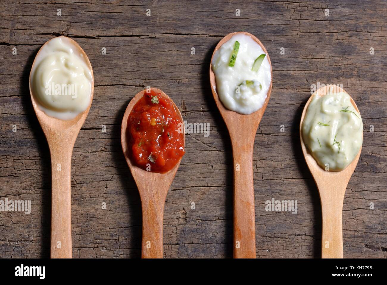 different types of sauces in spoons Stock Photo Alamy