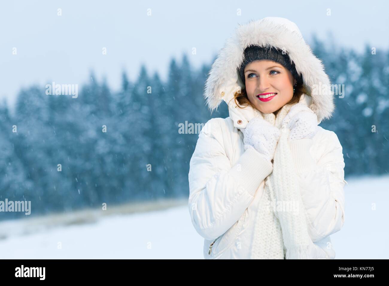 Winter, woman with warm outfit poses on outdoor, horizon format Stock ...