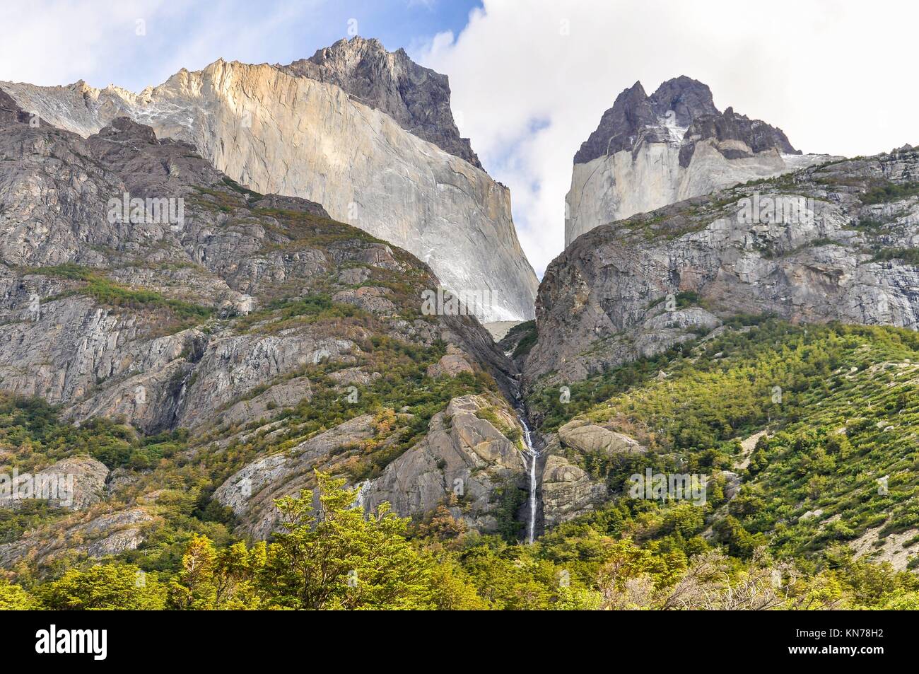 A waterfall between two peaks in the Torres del Paine National Park, Patagonia, Chile. Stock Photo