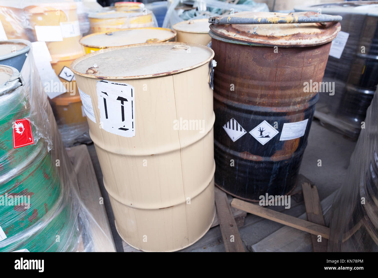 Rusty barrels with toxic chemical waste Stock Photo