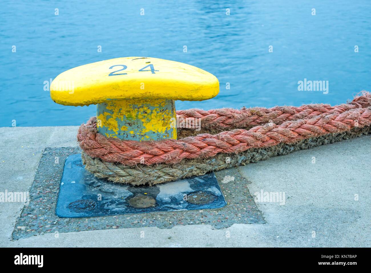 Bollard with mooring lines Stock Photo Alamy
