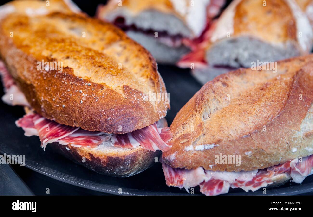 Closeup of a spanish bocadillos of cured ham or ham serrano sandwich. Stock Photo