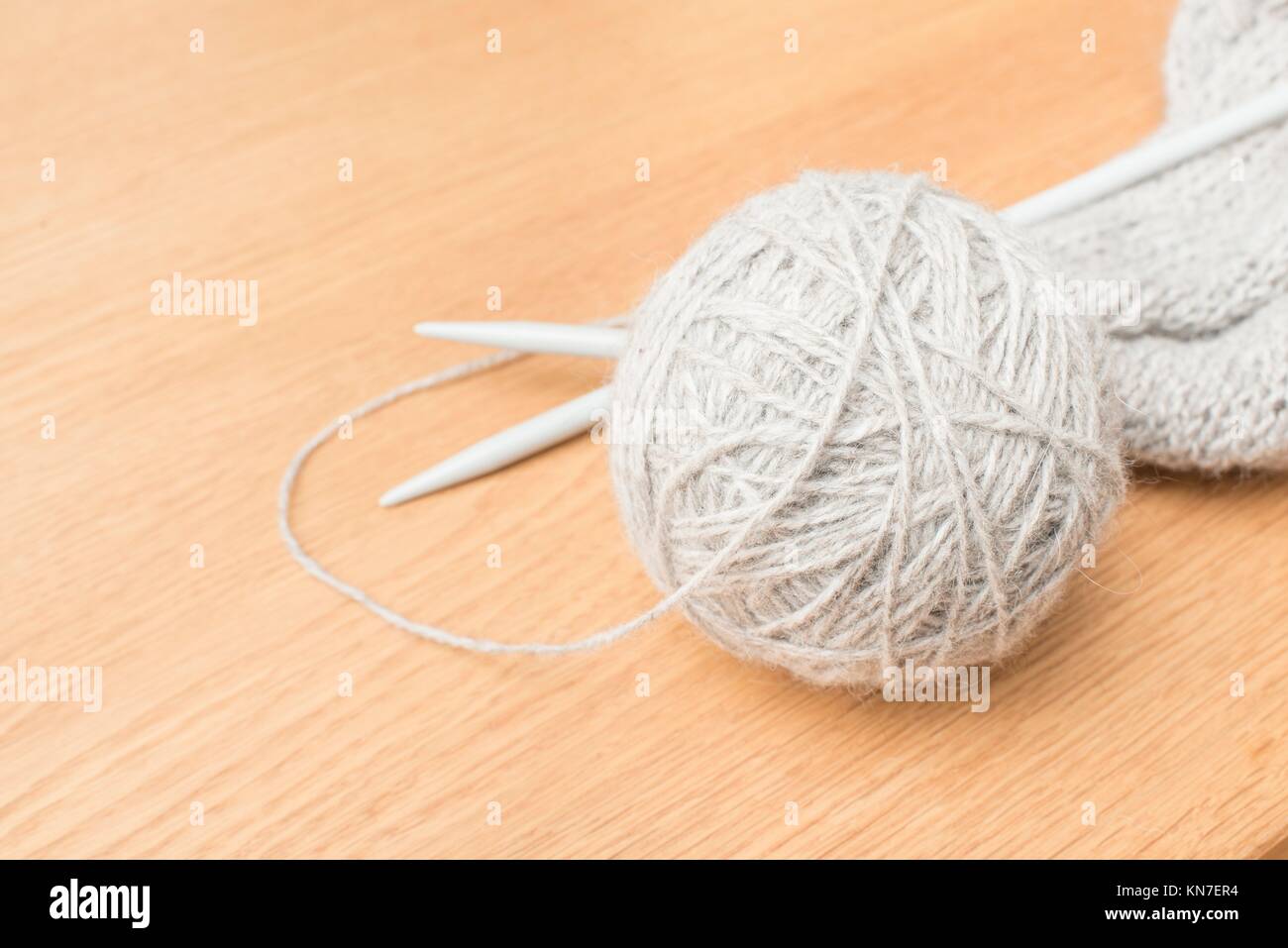 Balls of yarn with knitting needles in basket isolated on white background  Stock Photo by AtlasComposer