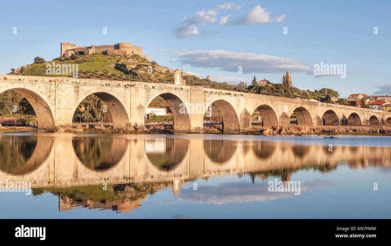 Medellin old bridge and castle from Guadiana riverside, Spain. Stock Photo