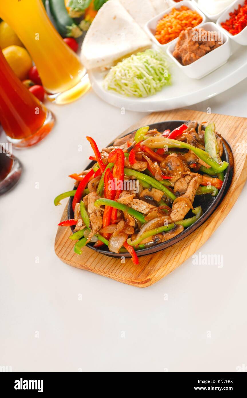 original fajita sizzling smoking hot served on iron plate, with