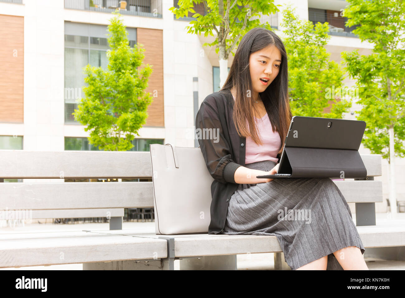Attractive Asian Chinese Girl Sitting on Park Bench Working on Laptop ...