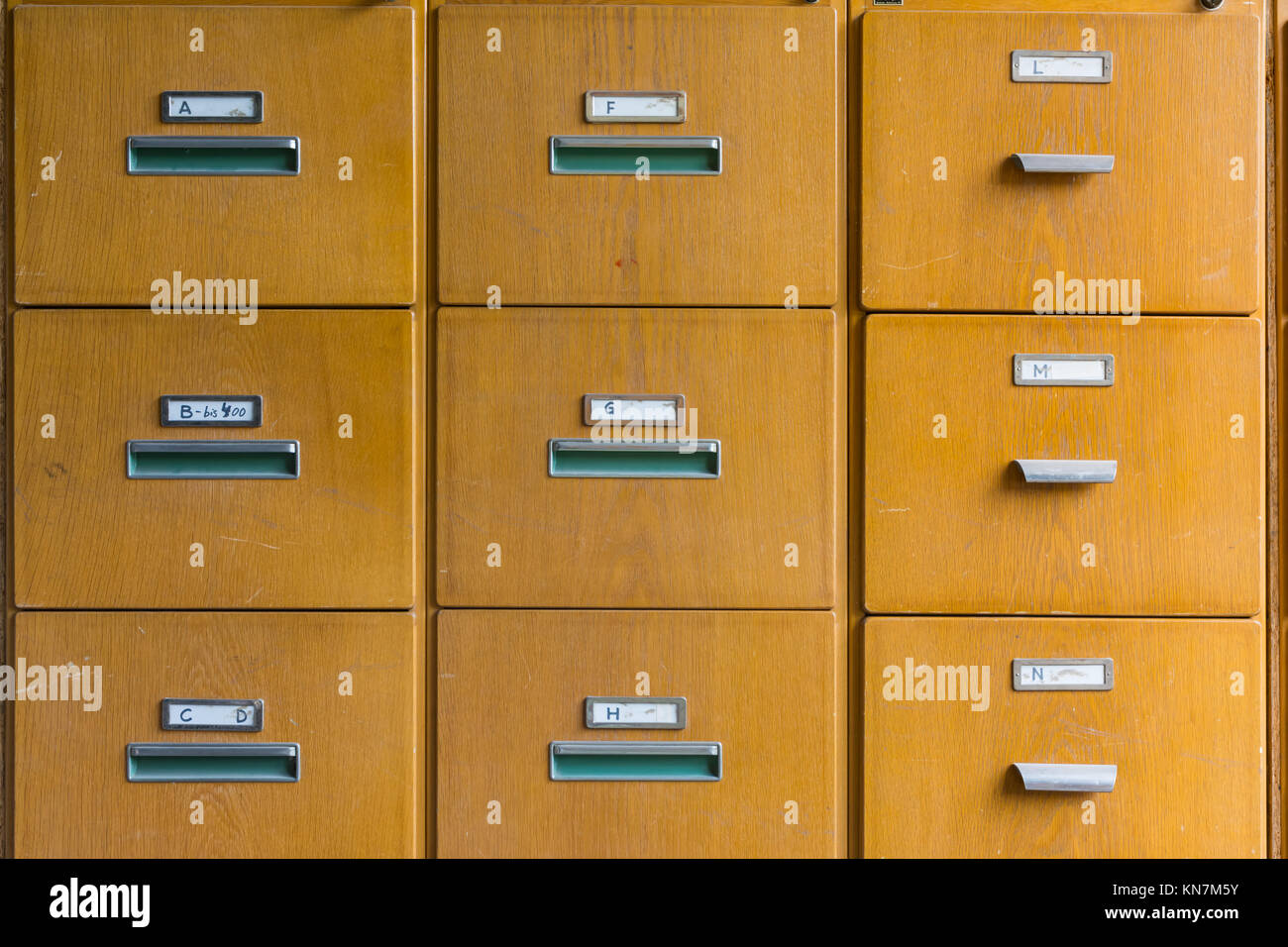 Wooden File Cabinet Straight On Geometric Pattern Squares Empty Labels  Doors Closed Old Vintage Brown Office Supply Stock Photo - Alamy
