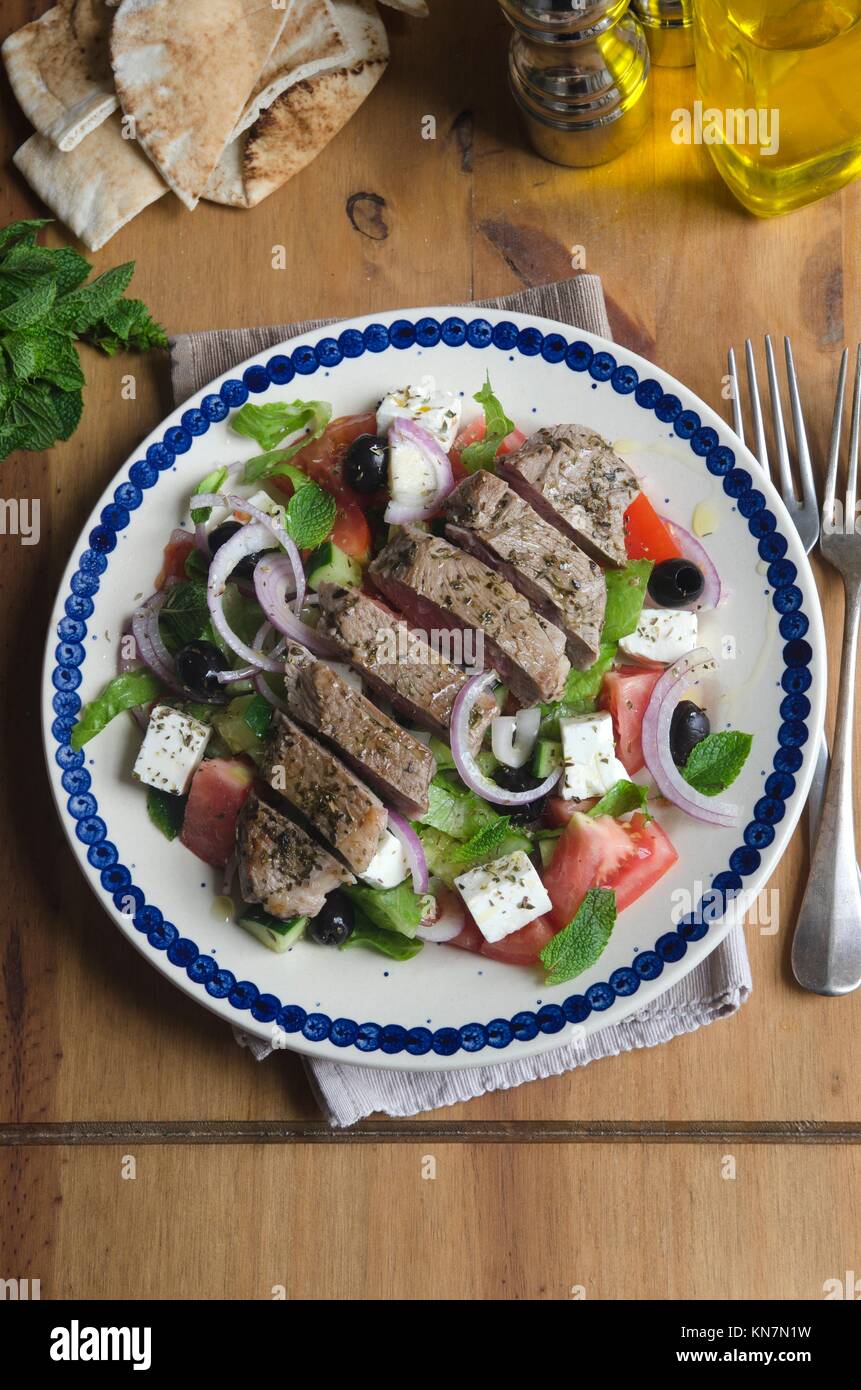 Traditional Greek salad with grilled lamb meat Stock Photo Alamy