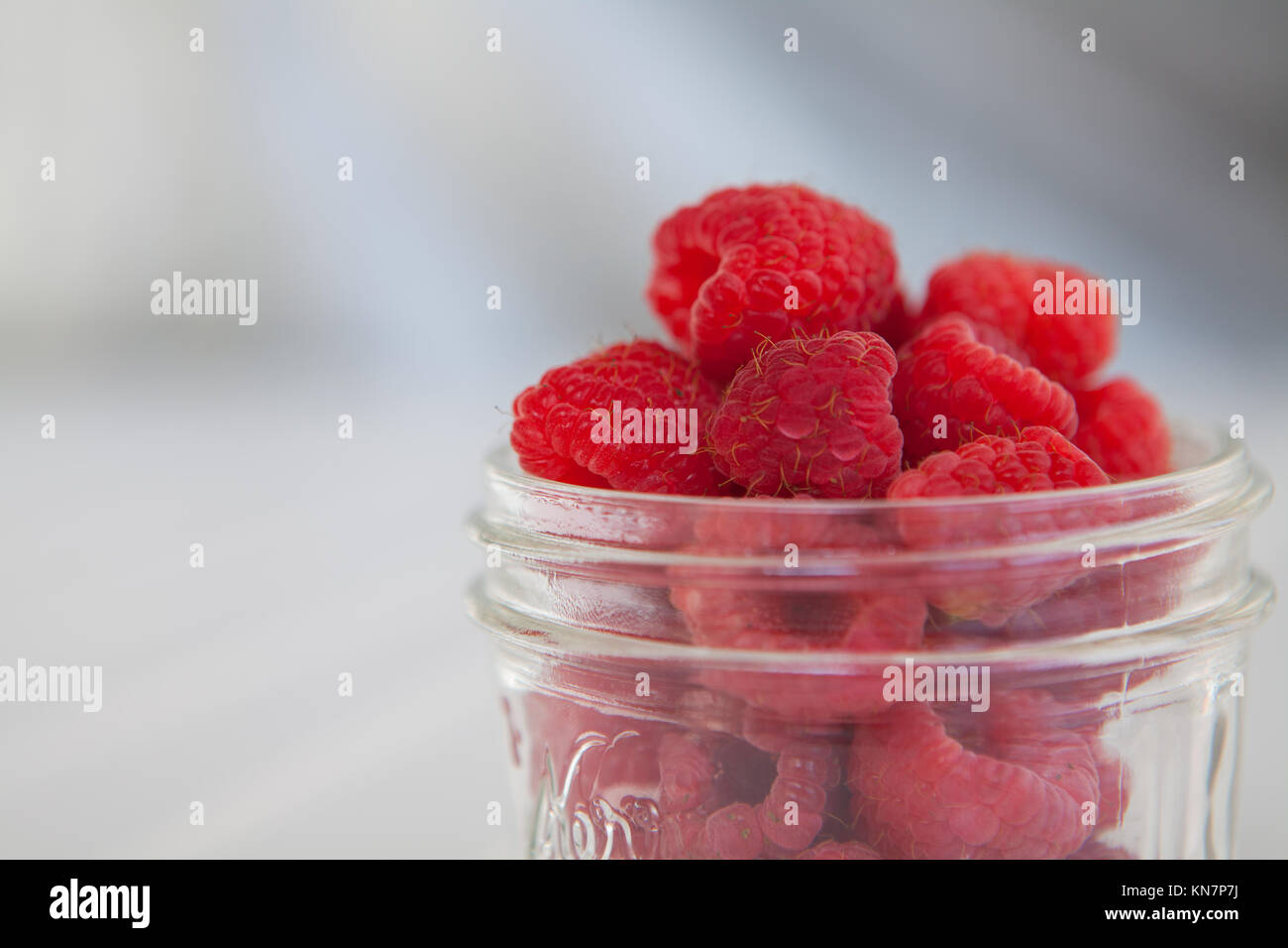 Mason jar of fresh raspberries Stock Photo Alamy