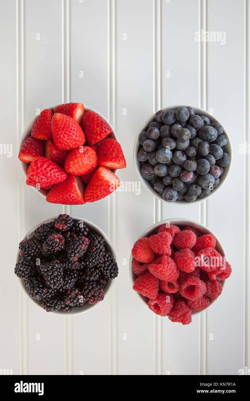 Mixed berries: raspberries, strawberries, blueberries and blackberries Stock Photo