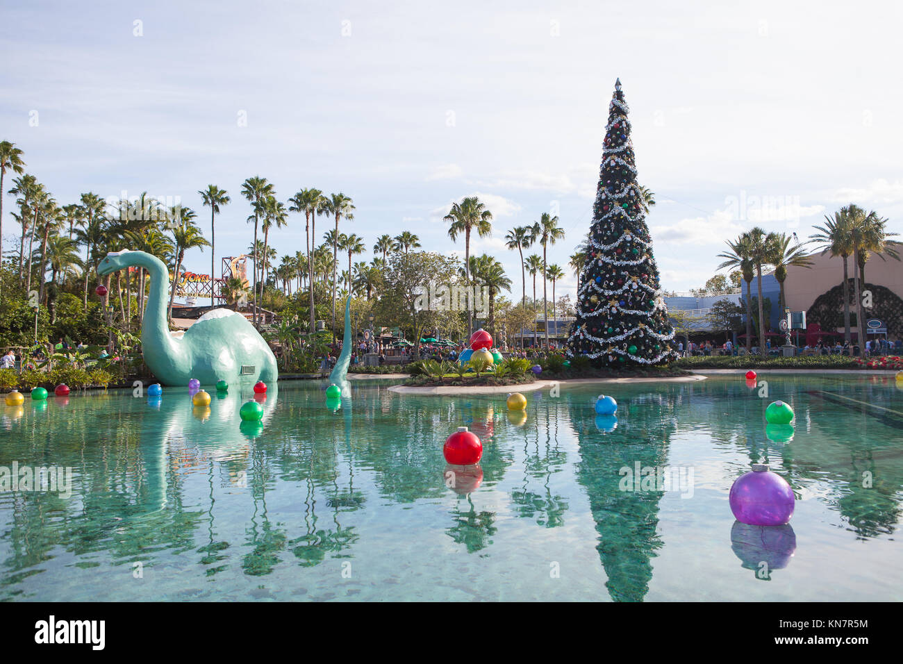 Gertie the dinosaur and Christmas decor on Echo Lake, Disney's Hollywood Studios, Orlando, Florida Stock Photo