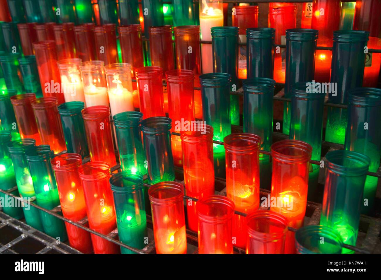 Red and green candles in the Monserrat Abby, Catalonia, Spain Stock