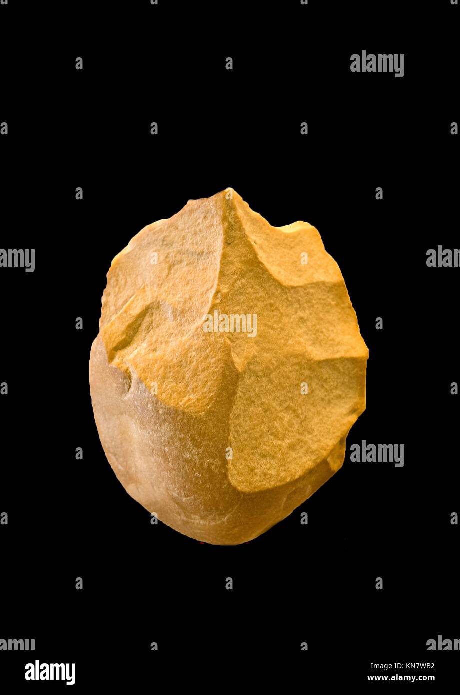 In archaeology, a biface is a two-sided stone tool and is used as a multi purposes knife, manufactured through a process of lithic reduction, that Stock Photo