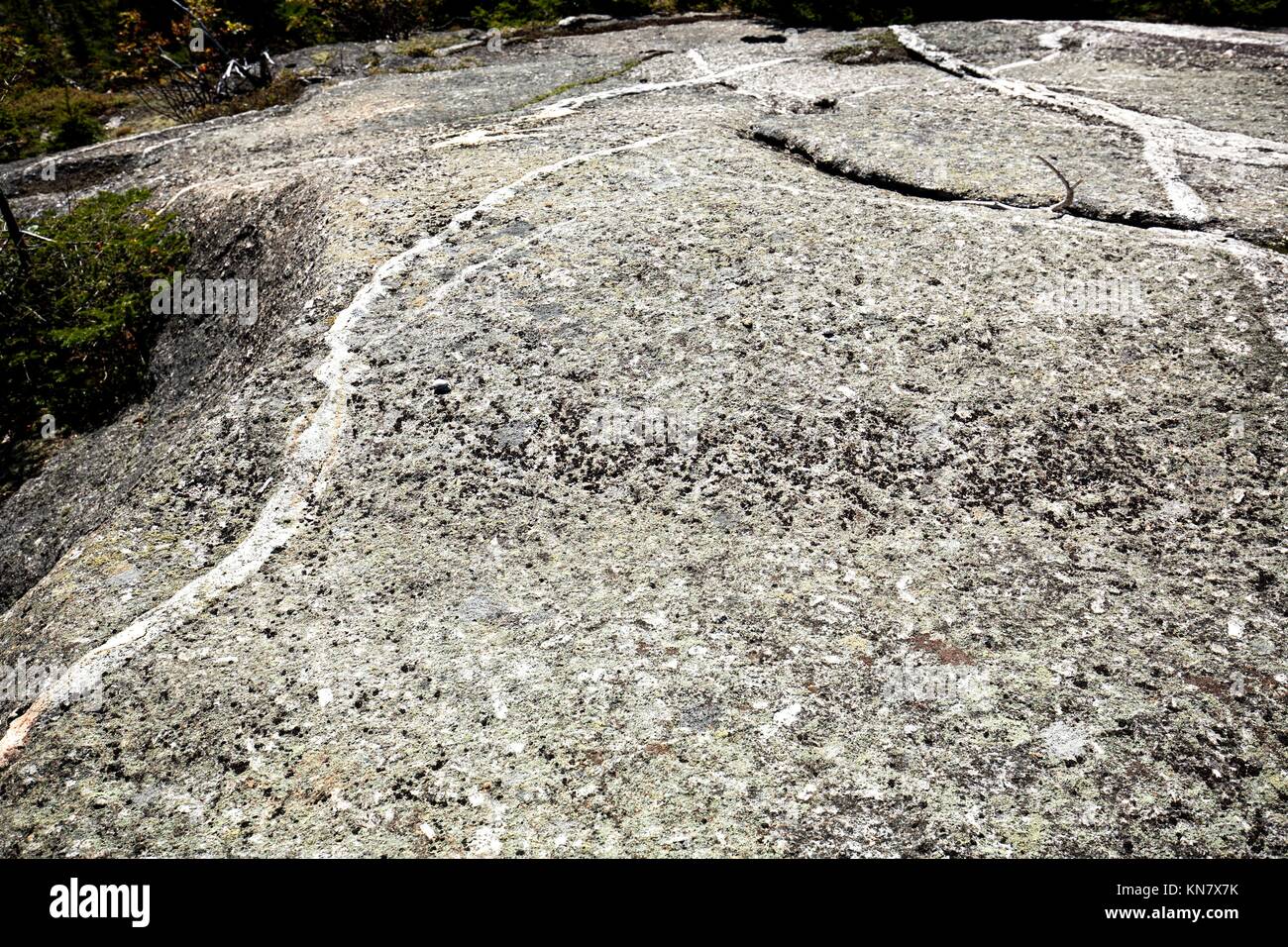 Glacial grooves in granite bedrock, legacy of the ice age on the summit of Mt. Cardigan near Grafton, New Hampshire. Stock Photo