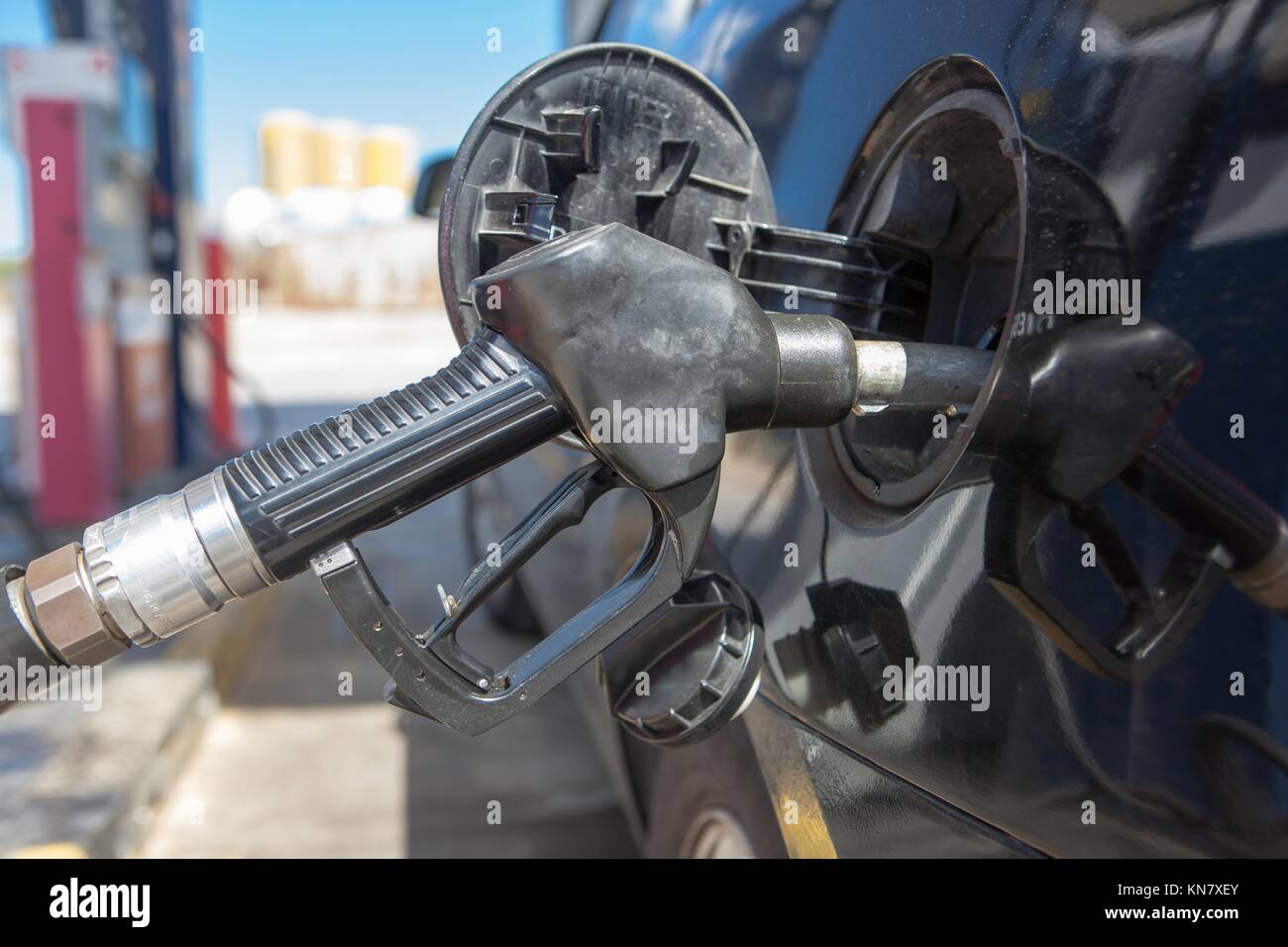 Car refueling on a petrol station. Nozzle detail. Stock Photo