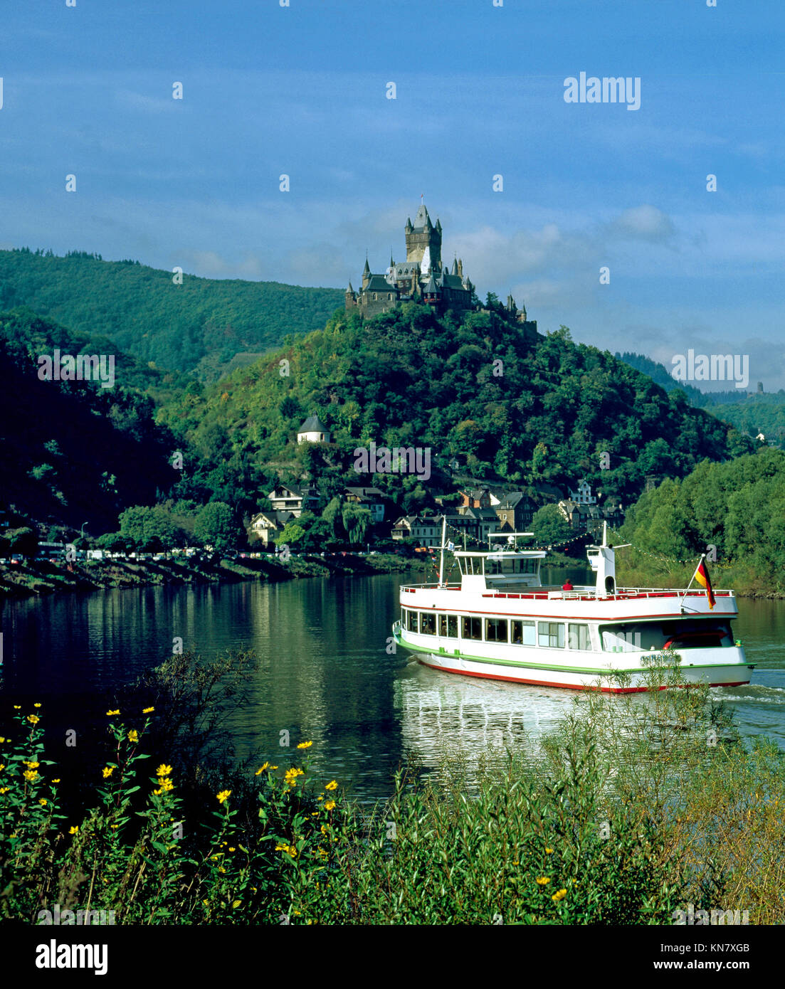 Pleasure Boat on the River Moselle near Cochem, overlooked by the Reichsburg Castle, Rhineland - Palatinate, Germany. Stock Photo