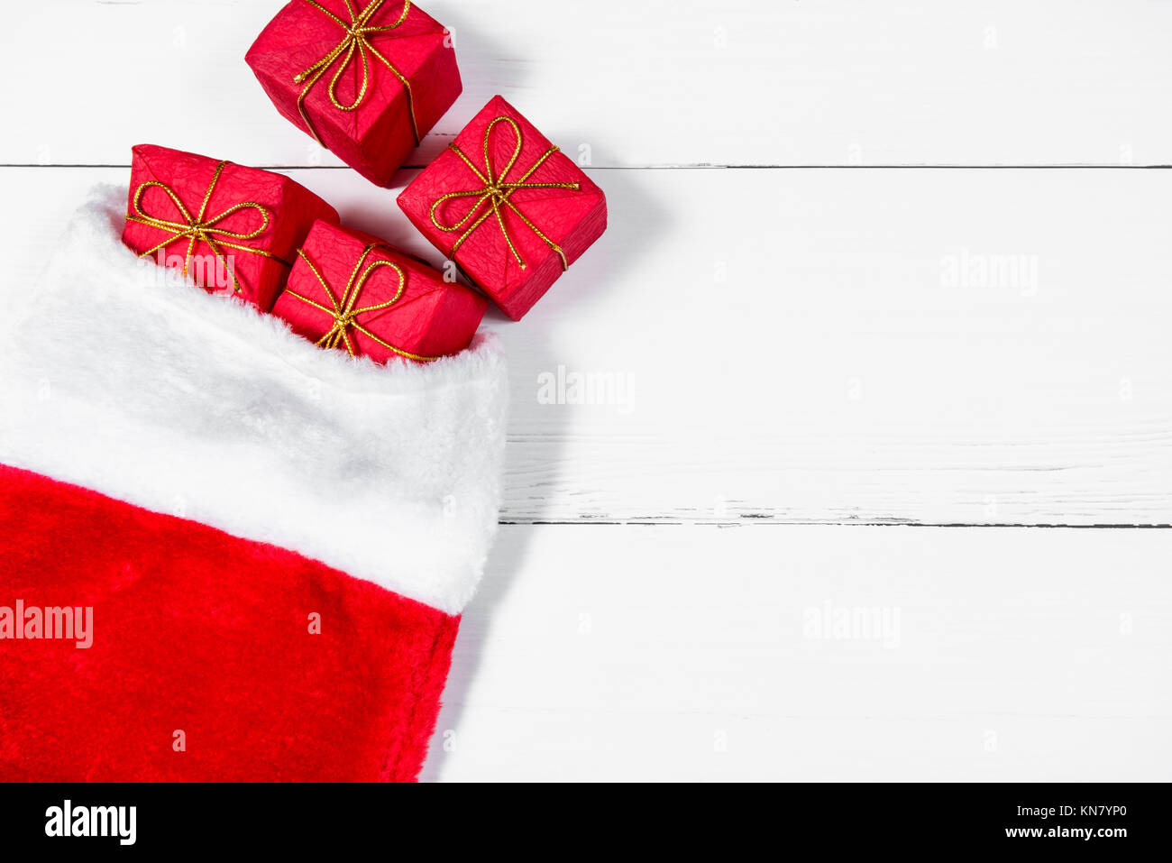 Christmas Stocking with Presents rolling out Stock Photo