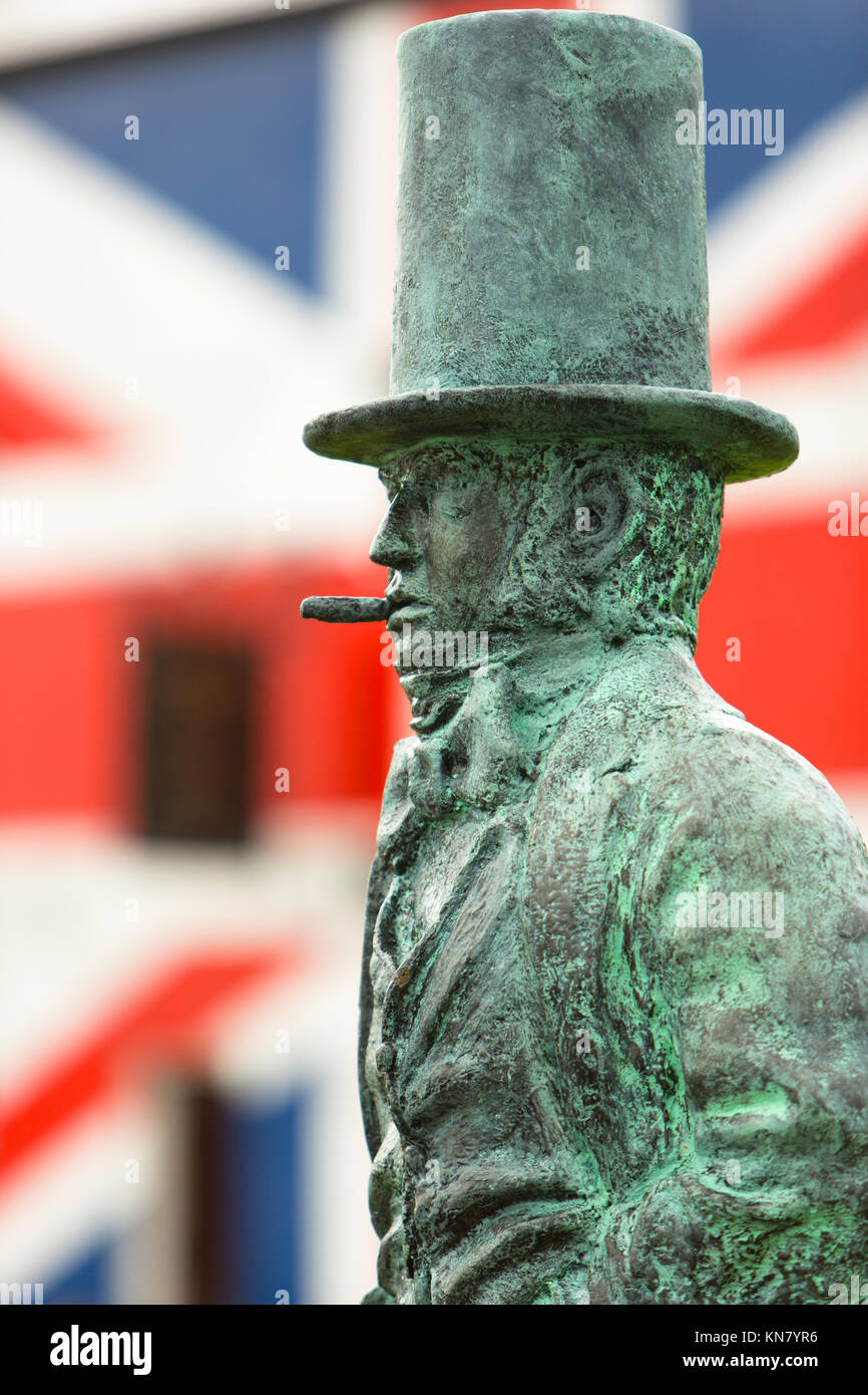 Statue of Isambard Kingdom Brunel with Cigar stands in front of a Union Jack flag, Saltash Stock Photo