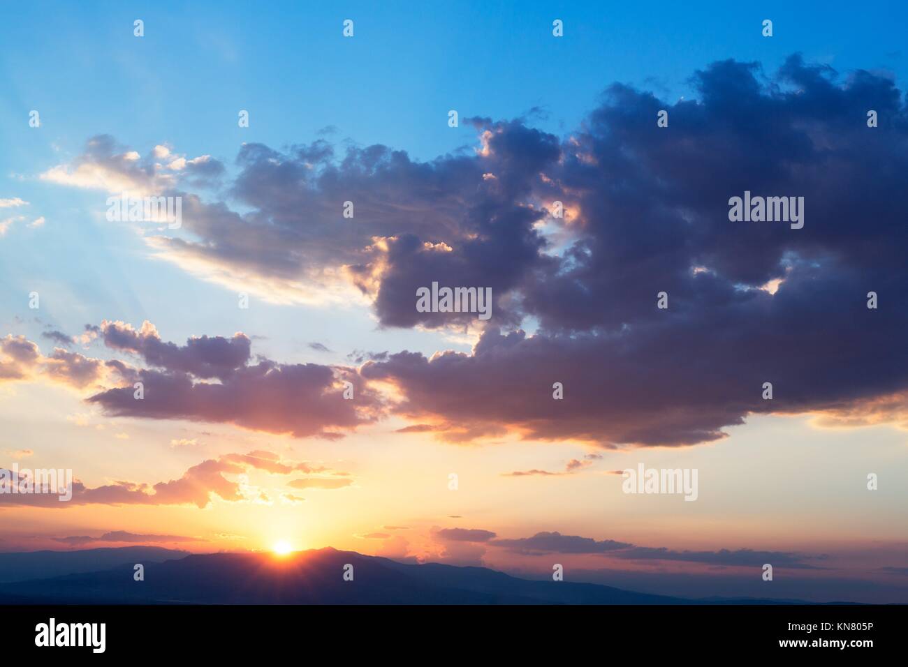 Sky with sun clouds at sunset rays. Stock Photo