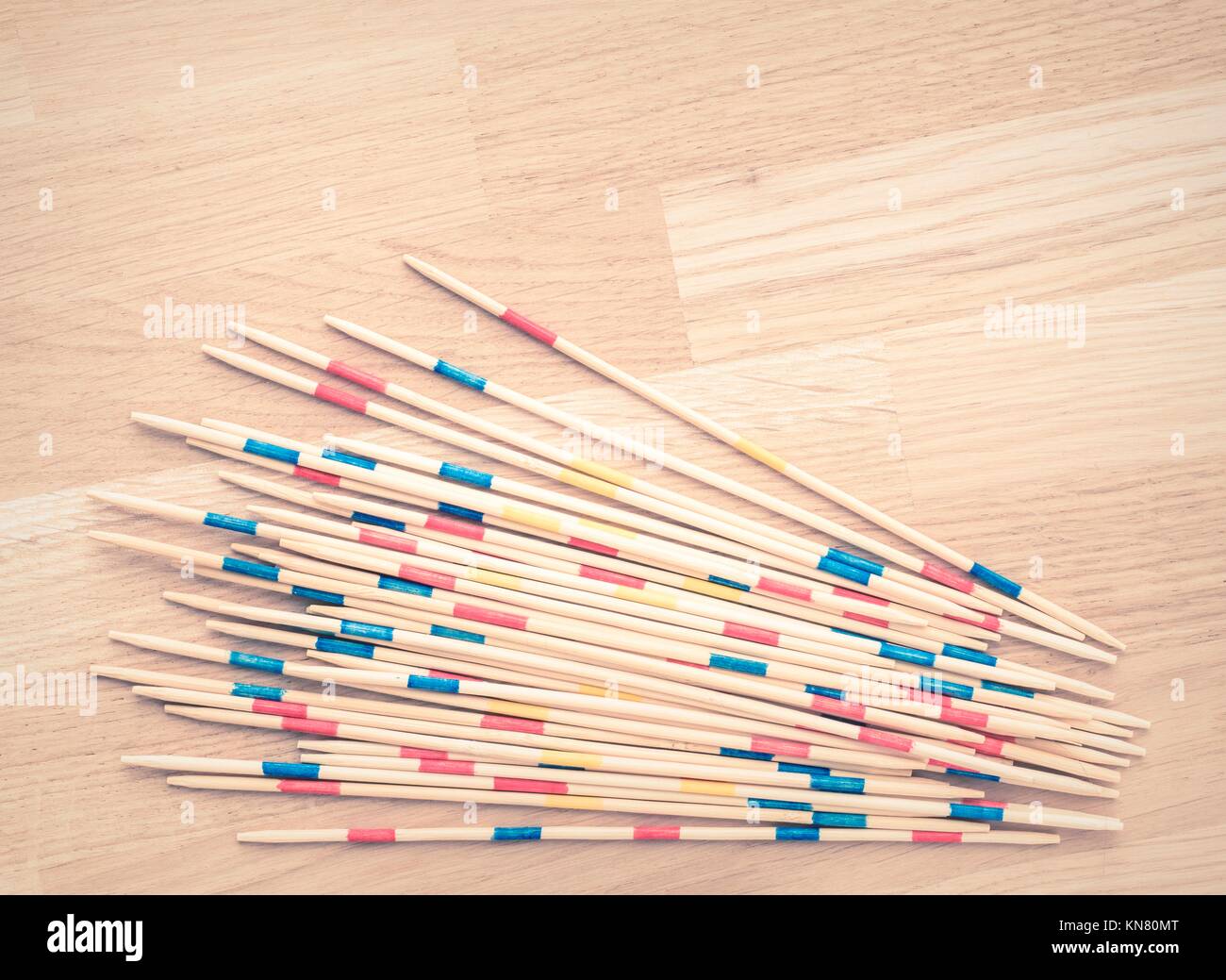 Mikado game wooden sticks on table with copy space. Classic game of