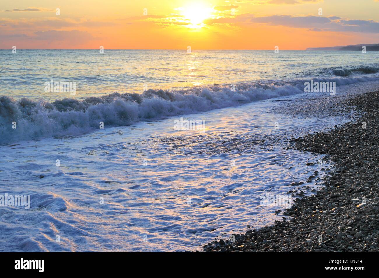 Seashore with pebble beach at sunset tide, Russia, Black sea Stock Photo